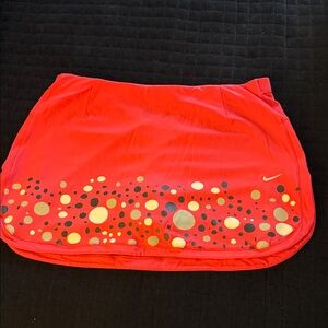 Nike Women's Pink Tennis Skirt with Gold Dot Pattern